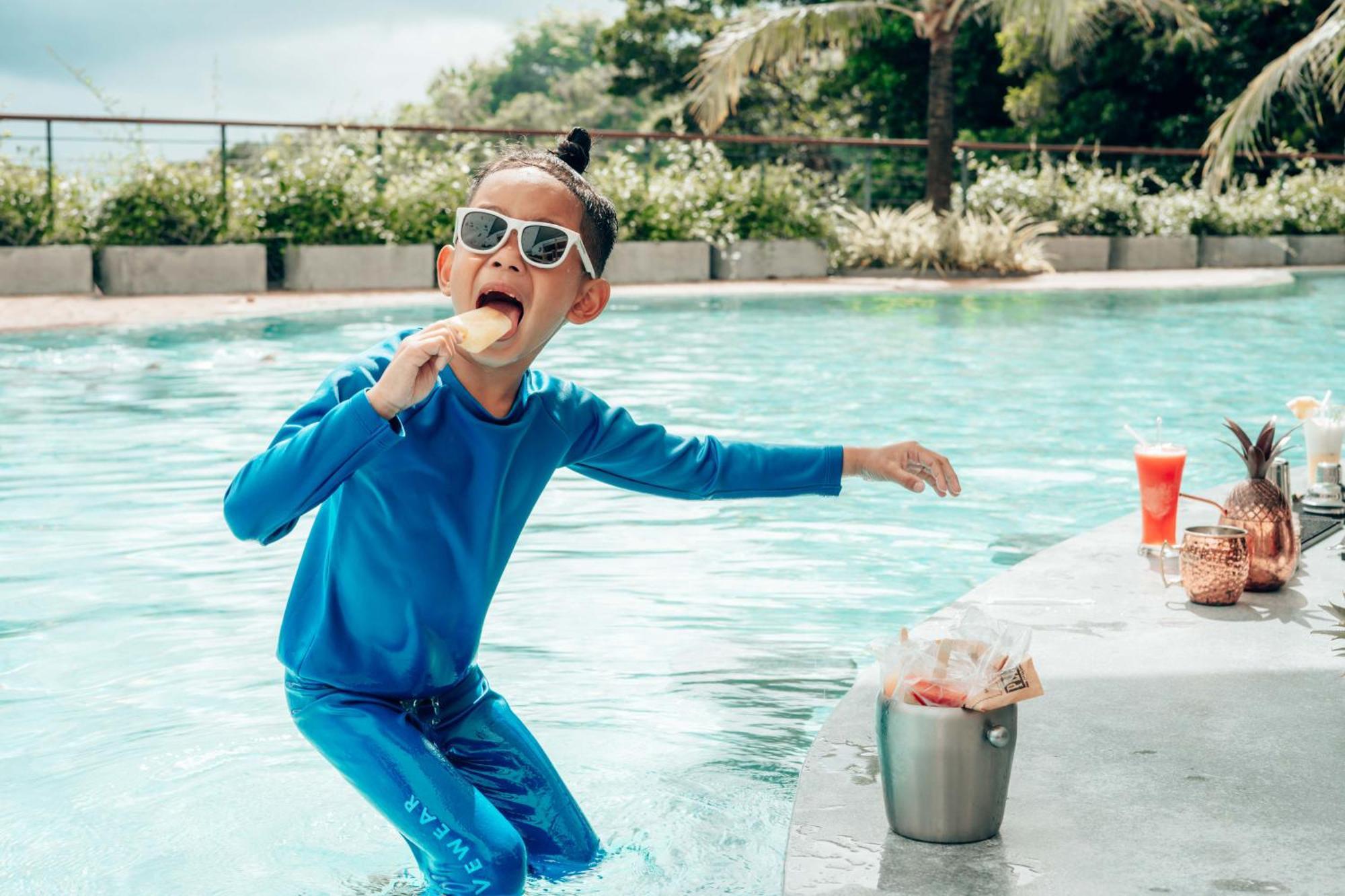Skyview Resort Phuket Patong Beach Exterior photo A child wearing a rash guard