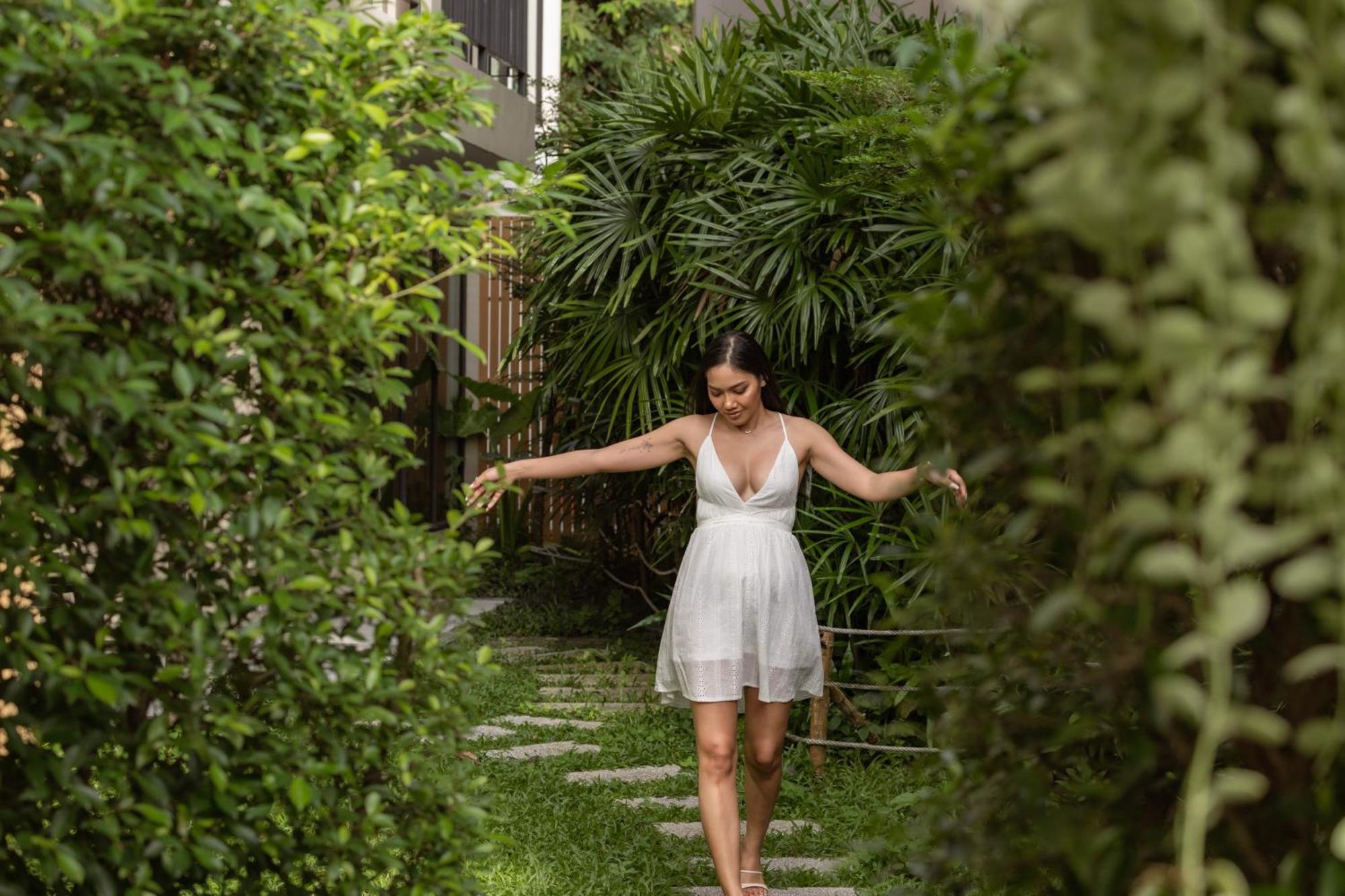 Skyview Resort Phuket Patong Beach Exterior photo A woman walking through a garden