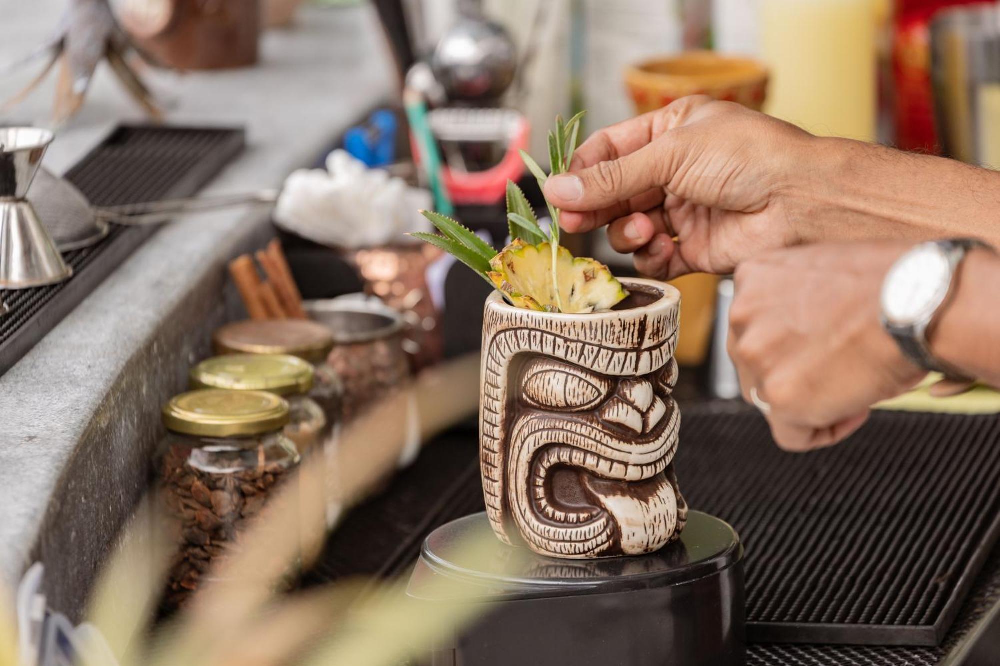 Skyview Resort Phuket Patong Beach Exterior photo A tiki drink being garnished