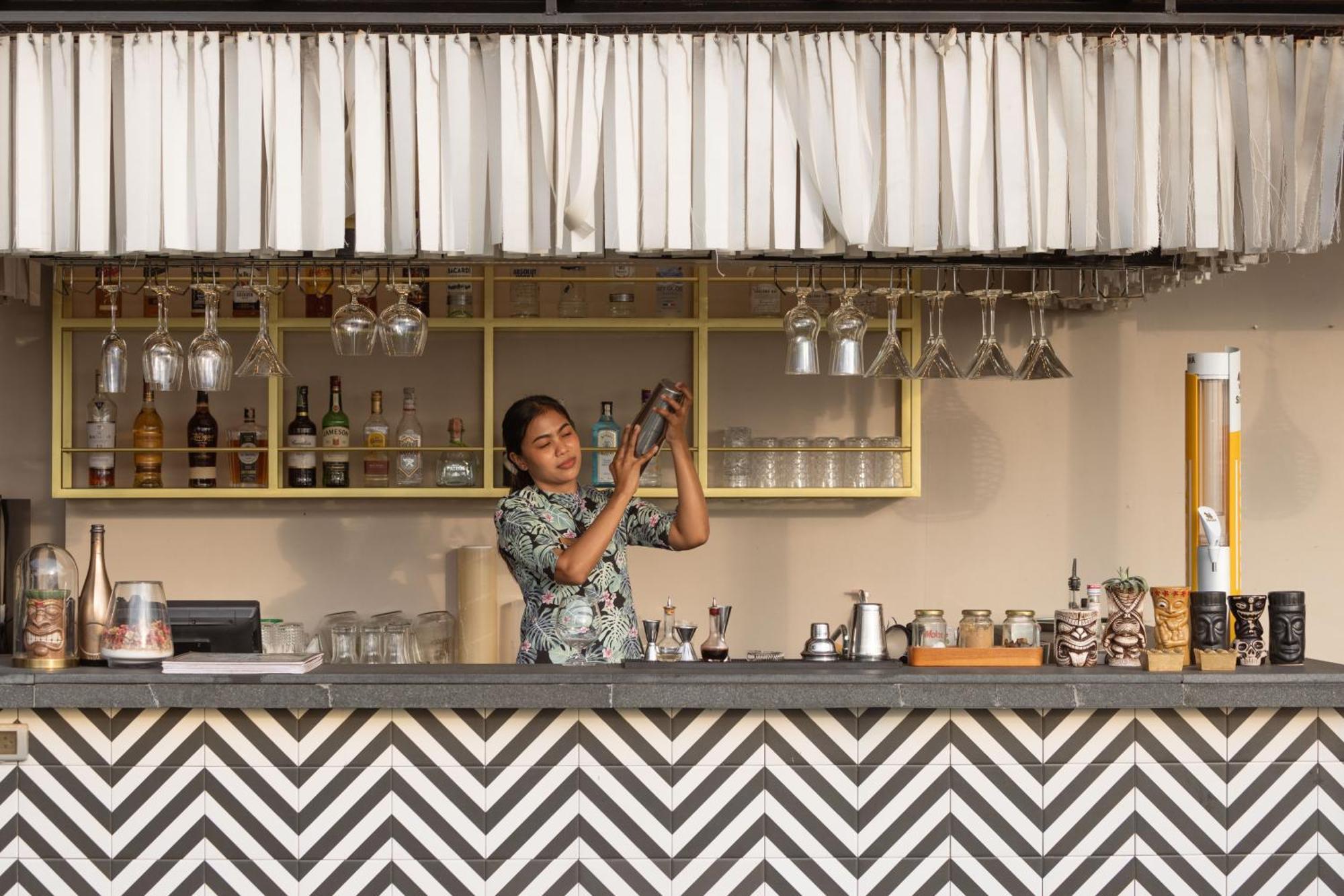 Skyview Resort Phuket Patong Beach Exterior photo A bartender at work
